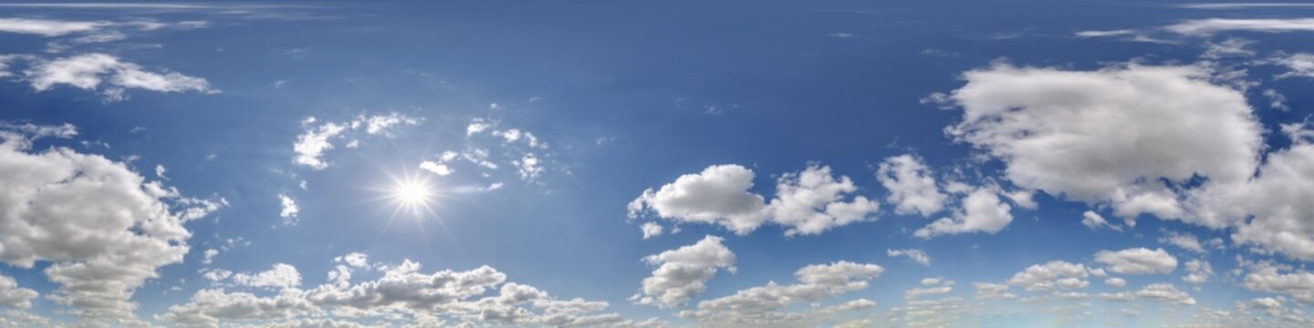 360 hdri blue sky with beautiful clouds with halo like a seamless panorama view with zenith for use in 3d graphics or game development as sky dome or edit drone shot