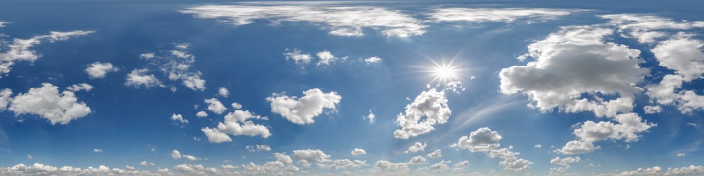 360 hdri blue sky with beautiful clouds with halo like a seamless panorama view with zenith for use in 3d graphics or game development as sky dome or edit drone shot