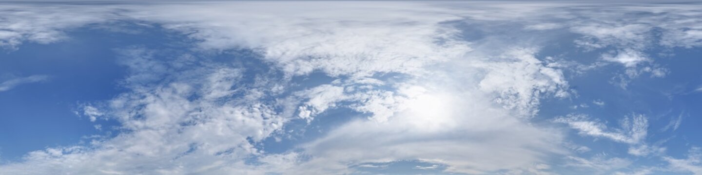 360 hdri blue sky with beautiful clouds with halo like a seamless panorama view with zenith for use in 3d graphics or game development as sky dome or edit drone shot