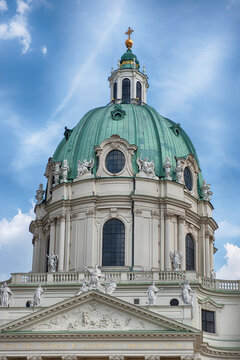 Stunning Baroque architecture of Karlskirche's dome with golden details, Vienna