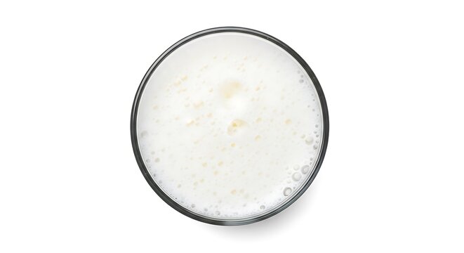 Top view of a glass of cold milk with foam isolated on white
