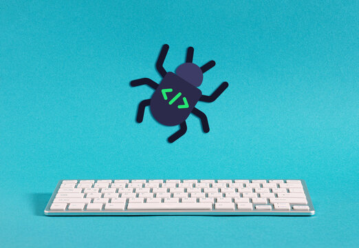 Software bug icon above a computer keyboard