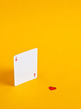 Ace of hearts playing card and heart symbol symbolizing lost love, a broken relationship, and missed opportunities