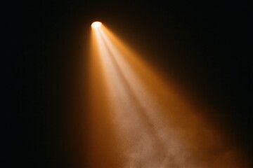 Obraz premium The Spotlight Casting Warm Amber Beams Across a Dark Theatrical Stage