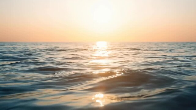Ocean Wave at Sunset with Golden Sunlight Reflection Across Calm Water Horizon