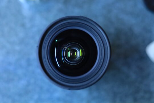 Top down view of a black camera lens glass element with photography lens