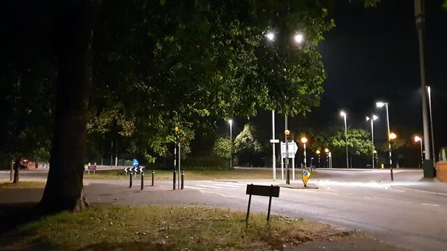 Illuminated Streets View of Luton Town of England United Kingdom During Night. Wide Angle Camera Footage Was Captured During Walk at Night of July 14th, 2026. Luton city is Located at North of London