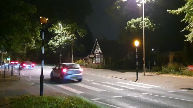 Illuminated Streets View of Luton Town of England United Kingdom During Night. Wide Angle Camera Footage Was Captured During Walk at Night of July 14th, 2026. Luton city is Located at North of London