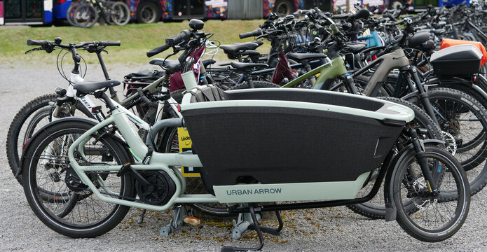 Germany, Paderborn, September 05. 2026, A light green Urban Arrow FamilyNext electric cargo bike with a large black EPP cargo box