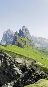 Alps mountain peak with green valley, symbolizing the challenging hiking journey. perfect for outdoor and travel-themed visuals. Travel and adventure. Mountain hiking. Seceda, Italy