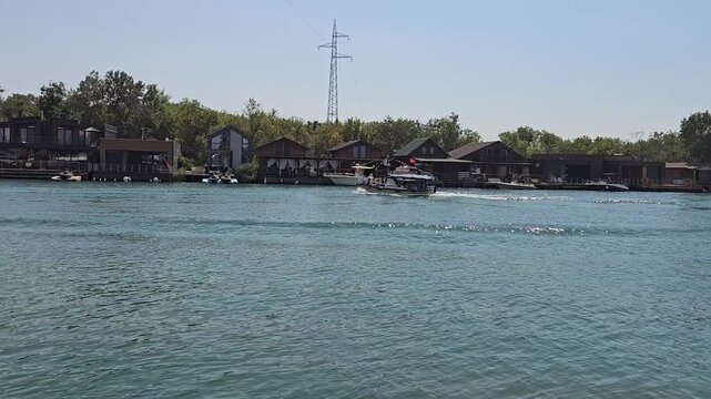 Buna river in montenegro with a motor boat moving throught the river