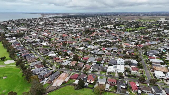 Aerial view of the dense residential street layout of Altona,&nbsp;row of suburban houses, private homes, and connecting neighborhood roads leading toward the coast. Melbourne, Victoria, Australia