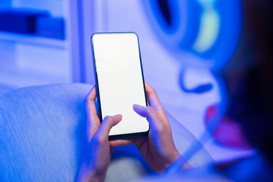 Hands holding smartphone with blank screen, mobile mockup and digital technology concept.