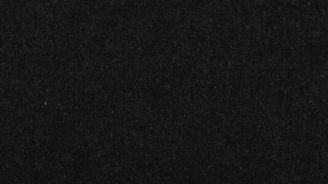 Stop Motion vintage black film grain texture with dust and scratches, stop motion animation in 4k, wrinkled surface and seamless looping. Distress looper grunge texture video effect.