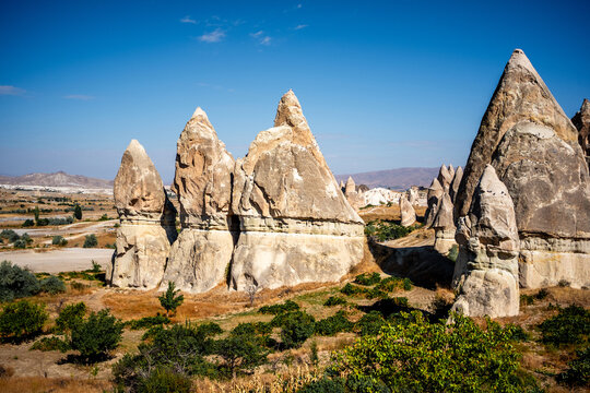 Cappadocia Turkey Features Stone Formations In A Valley With Shrubs As Part Of A Volcanic Terrain Erosion Natural Landscape