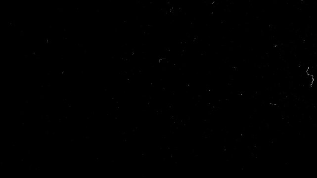 Scratches and dust dark grunge paper background. Scratched damaged dynamic overlay texture surface in trendy vintage stop motion style. 4k black grunge gritty abstract background loop animation.