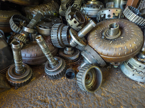Close-Up of Used Automotive Transmission Parts in Scrap Yard