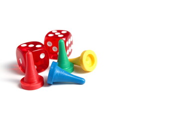 On a white background there are chips and dice for the game in bright colors. ©  DENIS  