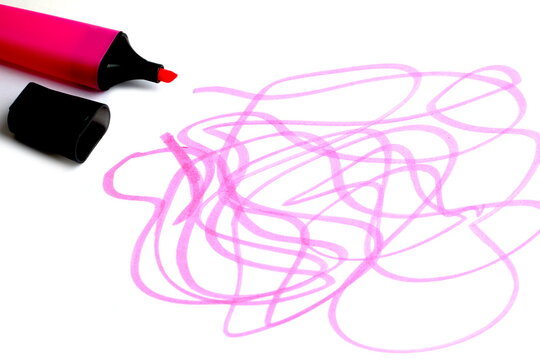 Scribbles are drawn with a pink marker on a white background.