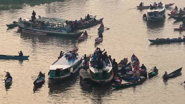 Traders sell fresh produce and local goods from boats at Lok Baintan Floating Market in Borneo