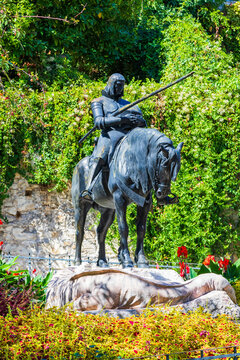 Saint George statue in front of Stone Gate surrounded by flowers in Zagreb, Croatia