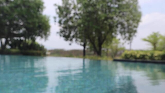 Abstract blur outdoor swimming pool in tropical resort hotel summer background