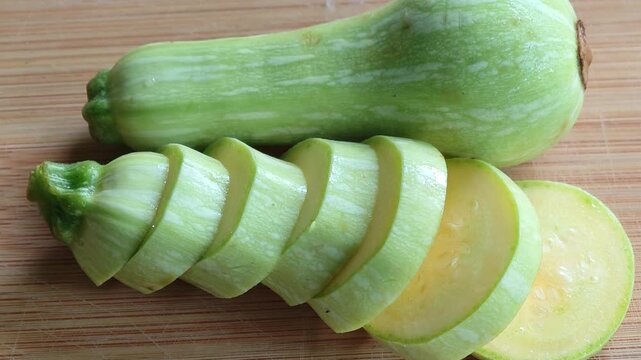 Sliced zucchini on cutting board