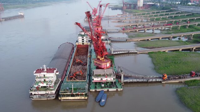 ** River port barges cargo cranes industrial China