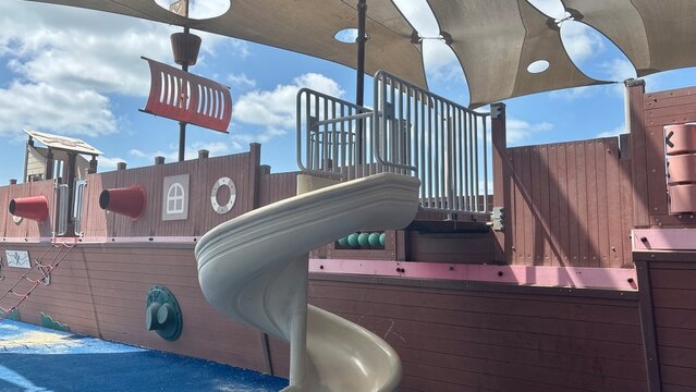 Pirate themed playground with a spiral slide, ship inspired structures and colorful outdoor play equipment in Ashdod, Israel