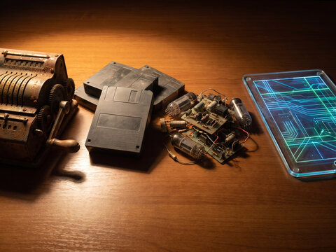 Vintage Electronics and Modern Tablet Arranged Together to Illustrate the Evolution of Digital Devices and Computing Technology