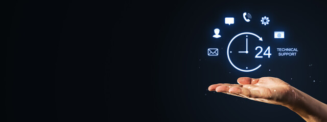 Obraz premium Hand presenting neon technical support interface with clock, contact icons and 24 hour service concept on dark background for modern business promotion.