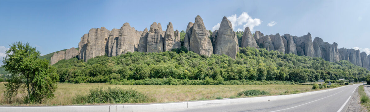road D4 and scenic Les Penitents geological formation near Les Mees, Provence, France