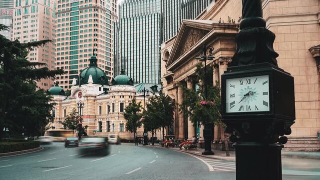 City street with blurred cars and clock tower