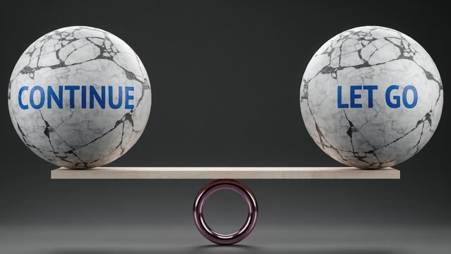 Two marble spheres with text continue and let go balanced on a seesaw against dark background. Perfect conceptual image for making difficult life decisions.