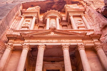 Looking up at the front facade of Al-Khazneh, the Treasury of the Pharaoh, in Petra, Jordan. This rose city was the capital for the Nabateans, and this tomb dates back around 2000 years. © Rixie