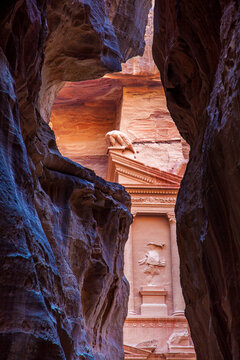 Looking at the front facade of Al-Khazneh, the Treasury of the Pharaoh, from the Siq, in Petra, Jordan. This rose city was the capital for the Nabateans, and this tomb dates back around 2000 years.
