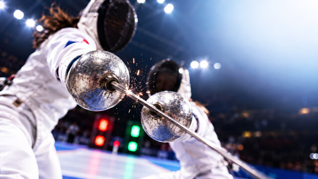 Female Fencers Clash Blades During High Intensity Competition
