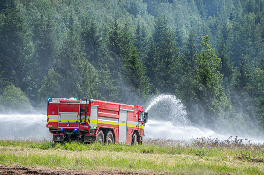 Fire Engine Spraying Water during a Demonstration 