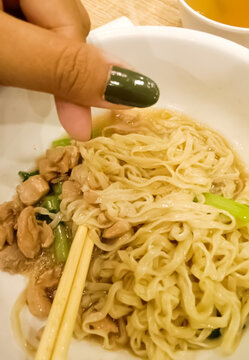 Homemade Indonesian chicken noodles (Mie Ayam) served in a bowl