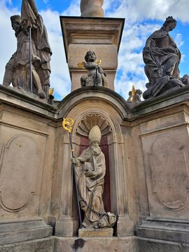Statue of Saint Procopius on the pedestal of Marian Plague Column in Broumov, Czech Republic