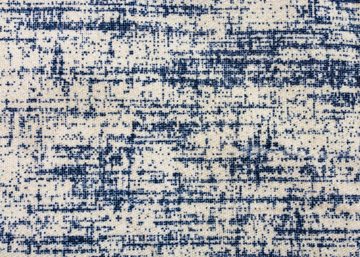 Distressed navy blue and white woven fabric texture showcasing an abstract grunge textile background