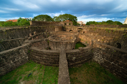 Historic Baluarte de San Diego Stone Fortress Ruins in Intramuros Manila Under Overcast Sky