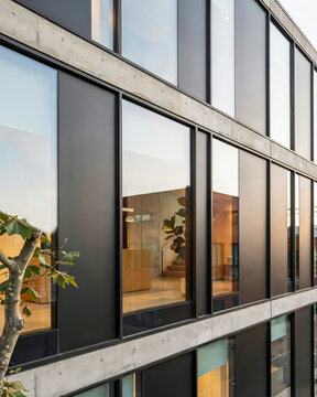Modern Building Facade with Large Windows and Concrete Elements modern architecture glass windows