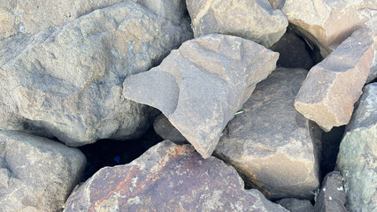 Close-up of Large Natural Grey Boulders and Textured Rock Formations in Pile ©  nur fatahillah