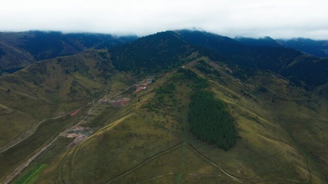 Scenic mountain near Kegen and Narynkol in Almaty Region, Kazakhstan, leading toward the China border. Majestic Tien Shan peaks, wide valleys and untouched landscapes create an impressive road tr