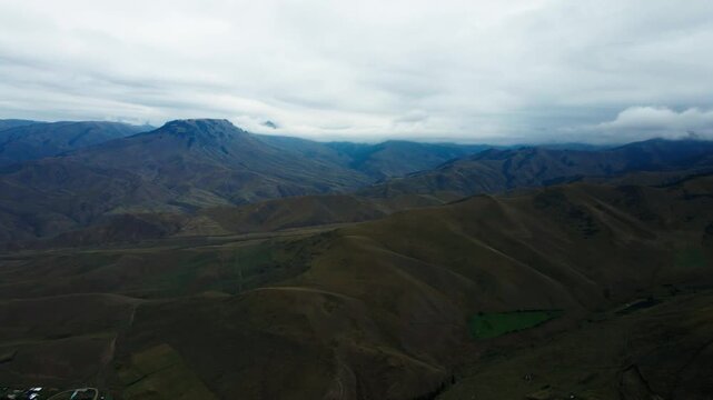 Scenic mountain near Kegen and Narynkol in Almaty Region, Kazakhstan, leading toward the China border. Majestic Tien Shan peaks, wide valleys and untouched landscapes create an impressive road tr