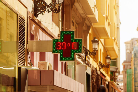 Outdoor pharmacy temperature display showing 39 degrees during extreme summer heat wave