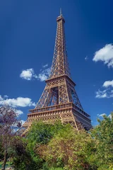 Eiffel Tower in Paris, France, against deep blue sky © mojolo