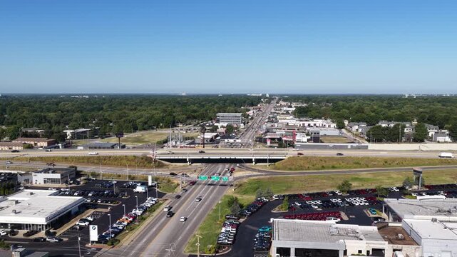 Aerial of highway 65 interchange and suburban development in Springfield Missouri with overpass and parking lots