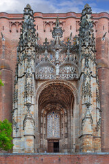 Front view of the gothic porch portal of Albi Cathedral in France. Overcast weather, cloudy sky, daytime lighting © borisb17